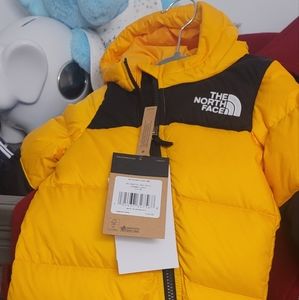 Northface snowsuit 3-6 months new with tags, yellow and black